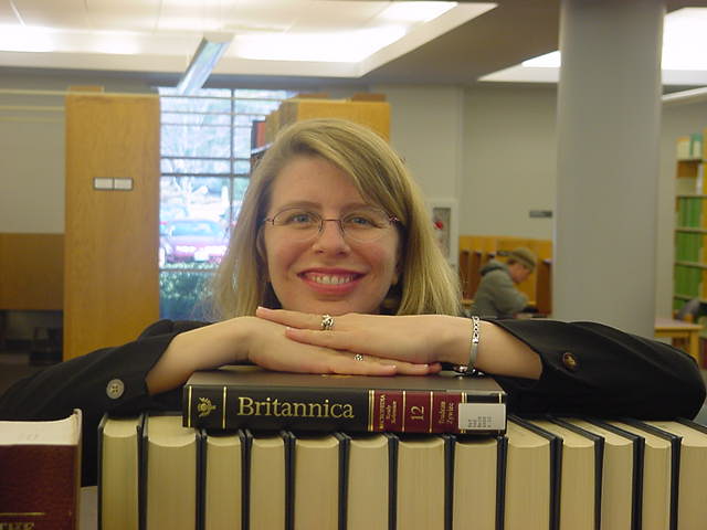 Britt Anne Murphy Leanning Over the Encyclopaedia Brittanica